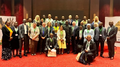 An image of a group of people standing together and posing for a photo.